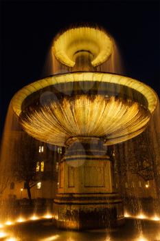 Fountain in the Geschwister-Scholl-Platz in the evening. Munich, Bavaria, Germany