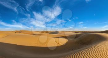 Panorama of dunes landscape with dramatic clouds in Thar Desert. Sam Sand dunes, Rajasthan, India