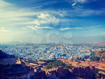 Vintage retro effect filtered hipster style panorama image of Jodhpur, known as Blue City due to blue-painted Brahmin houses. View from Mehrangarh Fort. Rajasthan, India
