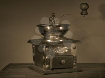 Manual coffee grinder in a darkness.Sepia.