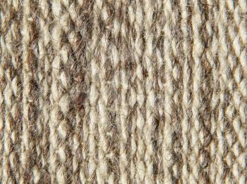 Rough knit camel wool fabric texture pattern as background.
