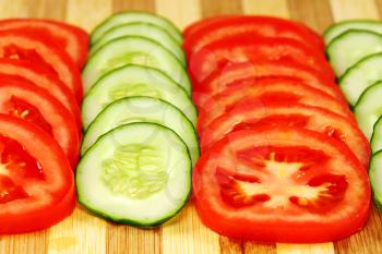 Slices of tomatoes and cucumbers.