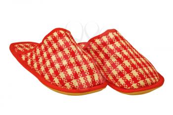Red checkered house slippers taken closeup isolated on white background.