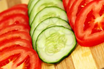 Slices of tomato and cucumber.