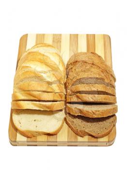 Slices of fresh bread on a cutting board isolated on a white background.