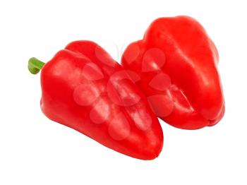 Two washed sweet red peppers isolated on a white background.