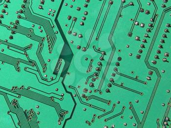 Green electronic microcircuit taken closeup suitable as background.
