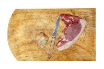 Raw pork meat, knife and onion on cutting board.Isolated.Top view.