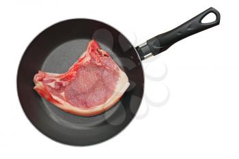 Raw pork meat in frying pan isolated on white background.Top view.