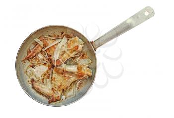 Roasted chicken wings in aluminum frying pan isolated on white background.Top view.