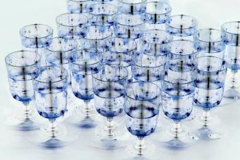 Turquoise water in transparent glasses taken closeup.Toned image.
