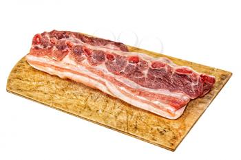Raw pork ribs on wooden cutting board isolated on white background.Toned image.