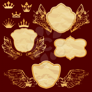 Set of vintage labels in shield shapes with old paper grunge texture, golden wings and crown.