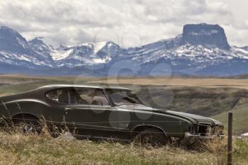Chief Mountain Waterton Park Alberta Canada old car foreground