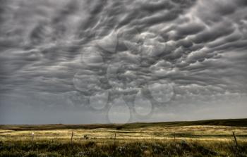 Storm Clouds Saskatchewan with farm field in foreground