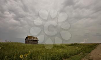 Storm Clouds Saskatchewan with old farmhouse and lightning