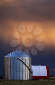 Storm Clouds Saskatchewan and farm storage granary