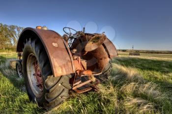 Antique Farm Equipment sunset Saskatchewan Canada