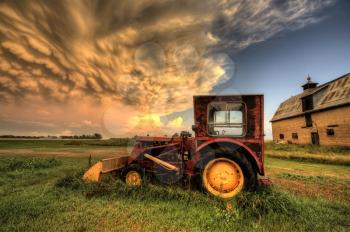 Storm Clouds Saskatchewan with antique vintage tractor