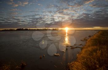 Sunset Saskatchewan slough pond reflection Canada