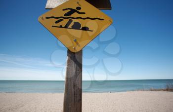 Swimmers warning sign along beach of Lake Winnipeg