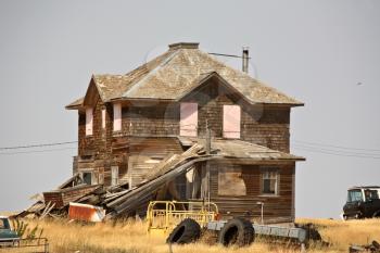 Junk around an abandoned Saskatchewan farm house