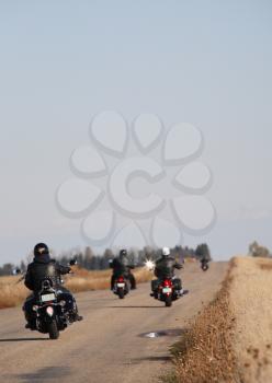 Motorcyclists drving down a Saskatchewan road