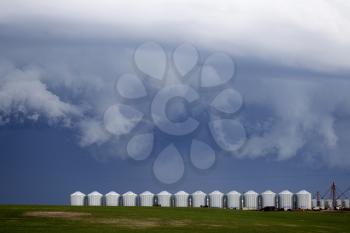Storm Clouds Saskatchewan granaries in a row