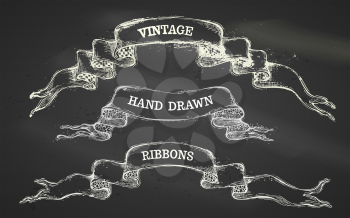 Vintage hand-drawn chalk design elements on blackboard background. There is copy space for your text.