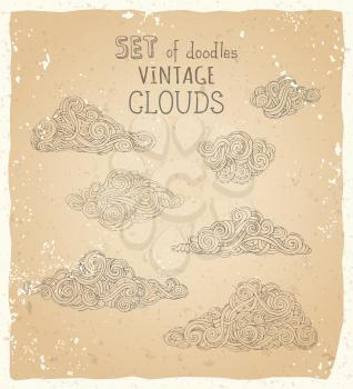 Linear clouds on old paper background. Hand-drawn swirls, scribbles, spirals, curls and patterns.