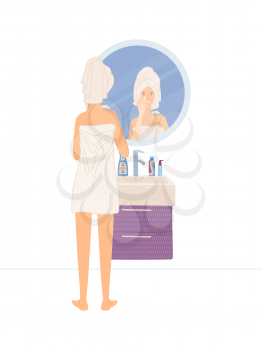 Young woman wearing towel after shower looking at her reflection in round mirror. Cute girl putting day lotion on her skin. Everyday morning routine. Skincare and beauty.