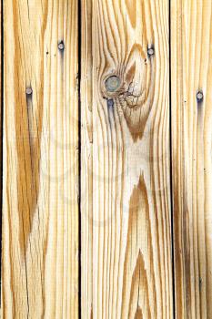 stripped paint in the blue  wood door and rusty    nail