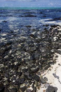 beach and rocks in ile du cerfs mauritius