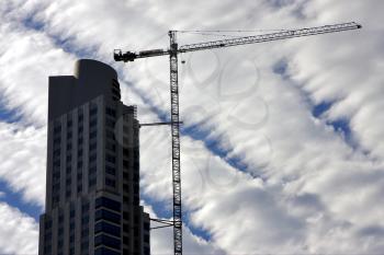 skyscraper clouds and crane in  buenos aires argentina