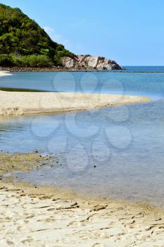 asia in thailand kho phangan bay isle white  beach    rocks pirogue  and south china sea 