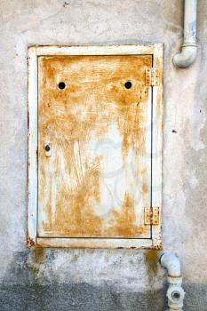 abstract  steel  padock zip in a   closed rusty metal pattern door   varese italy sumirago