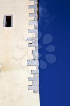 cross sumirago lombardy italy  varese abstract   wall of a curch broke brike pattern sunny day  and sky