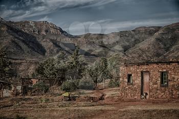 blur  in lesotho malealea street village near  mountain  and coultivation field