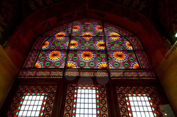 in iran blur colors from the windows the old mosque traditional scenic light