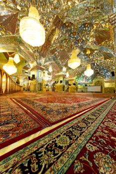 blur in iran inside the old antique mosque with glass and mirror traditional islam architecture
