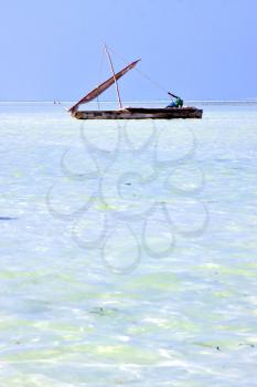 zanzibar beach  seaweed in indian ocean tanzania    sand isle   sky and boat
