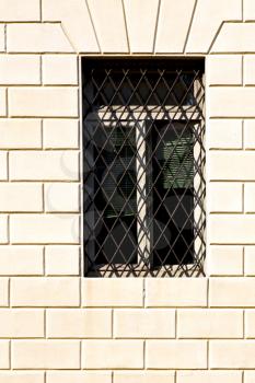 shutter europe  italy  lombardy       in  the milano old   window closed brick      abstract grate