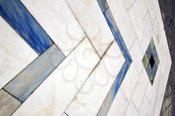 direction  sanpietrini busto arsizio  street lombardy italy  varese abstract   pavement of a curch and marble
