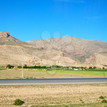 in iran blur mountain and landscape from the window  of a car