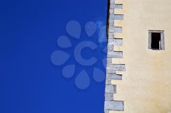 cross sumirago lombardy italy  varese abstract   wall of a curch broke brike pattern sunny day  and sky 