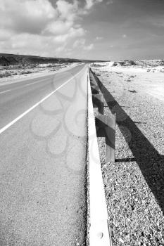 in oman old asphalt road near the coastline 