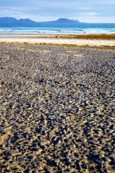 people froth coastline in lanzarote spain pond  rock stone sky cloud beach  water  musk  and summer    
