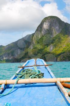 blur  in  philippines   view of the island hill from the prow of a boat