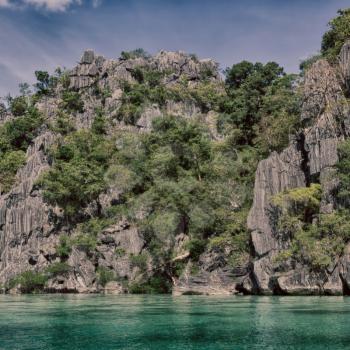 from a boat  in  philippines  snake island near el nido palawan beautiful panorama coastline sea and rock 