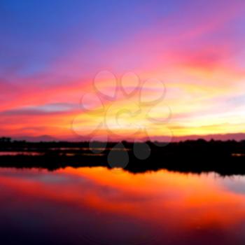 blur  view from water of the sunrise full of colors and rain concept of relax
